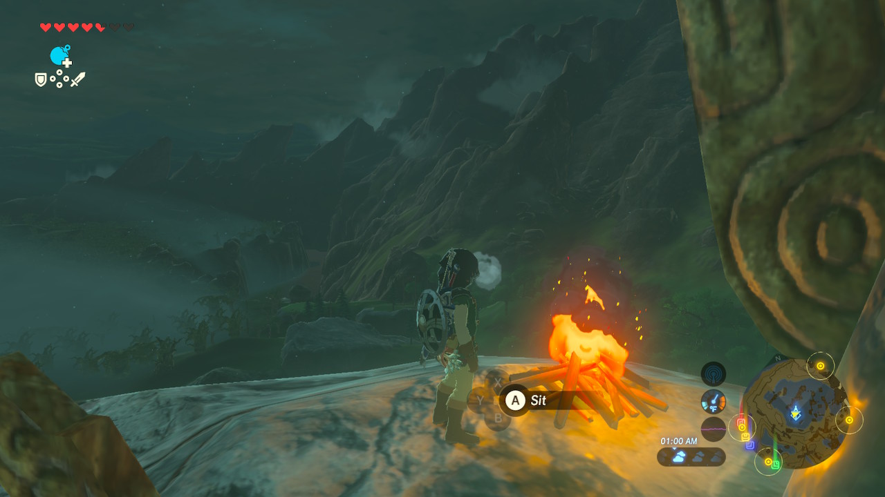 Link from Breath of the Wild standing near a campfire on a tower overlooking the foggy Lost Woods.