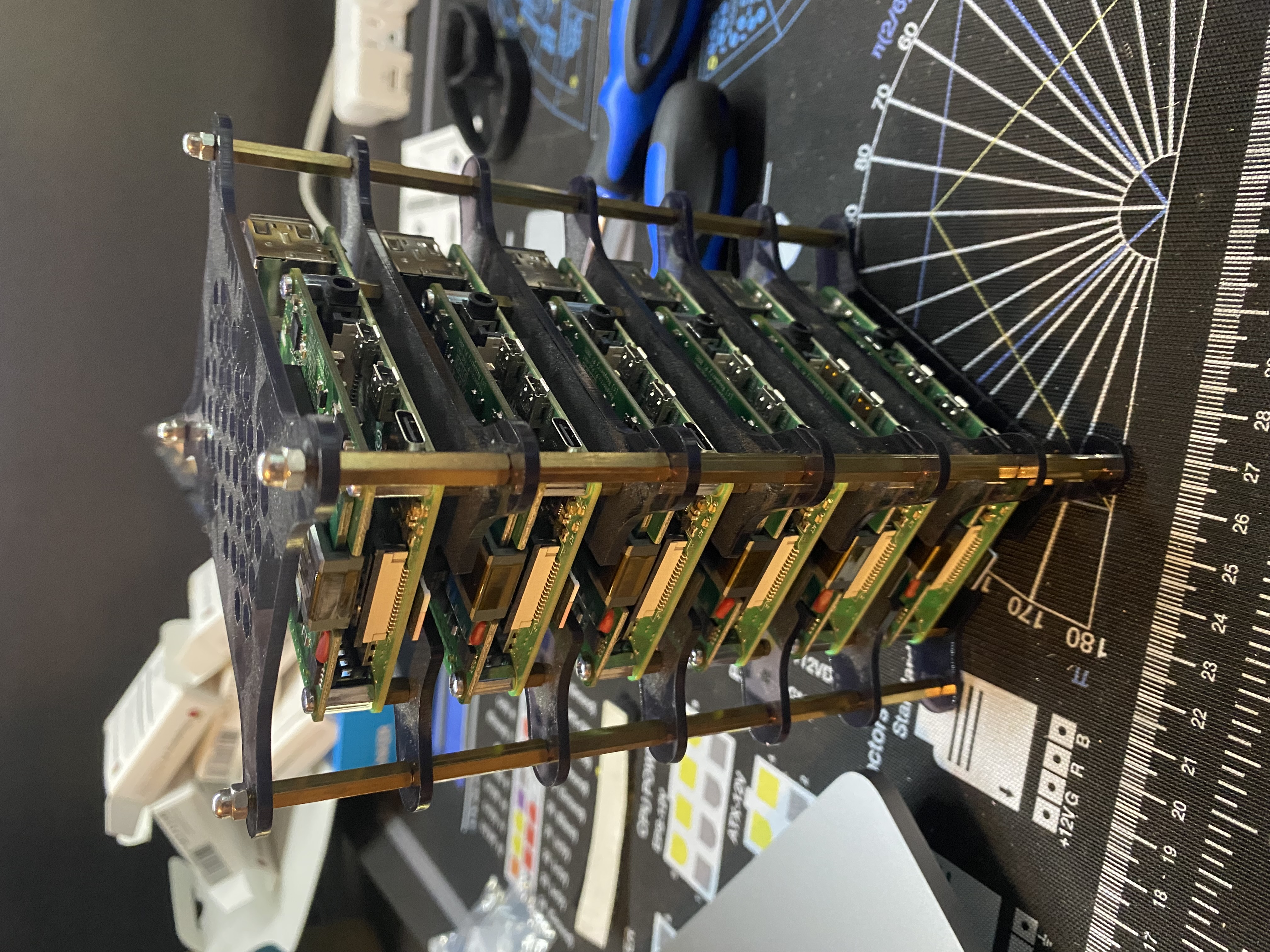 The reassembled Pi cluster, with six Raspberry Pi boards stacked up, each with a PoE HAT.
