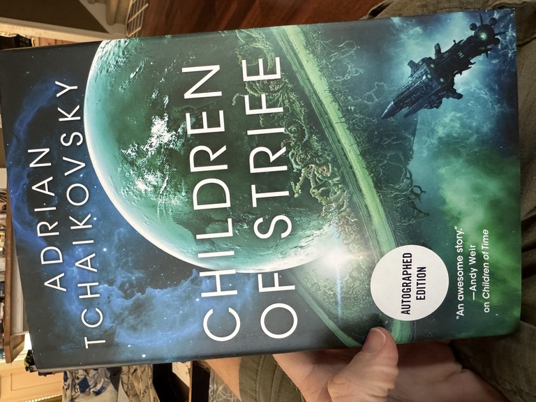 Adrian Tchaikovsky's newest book in the _Children of Time_ series, _Children of Strife_. Shows a hardcover book in the same style as the other books in the series, though the planet is a sickly green.